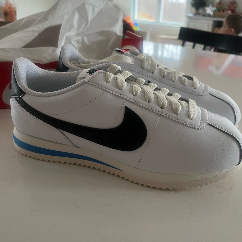 Nike women’s White and Black Sneakers with Blue Accent